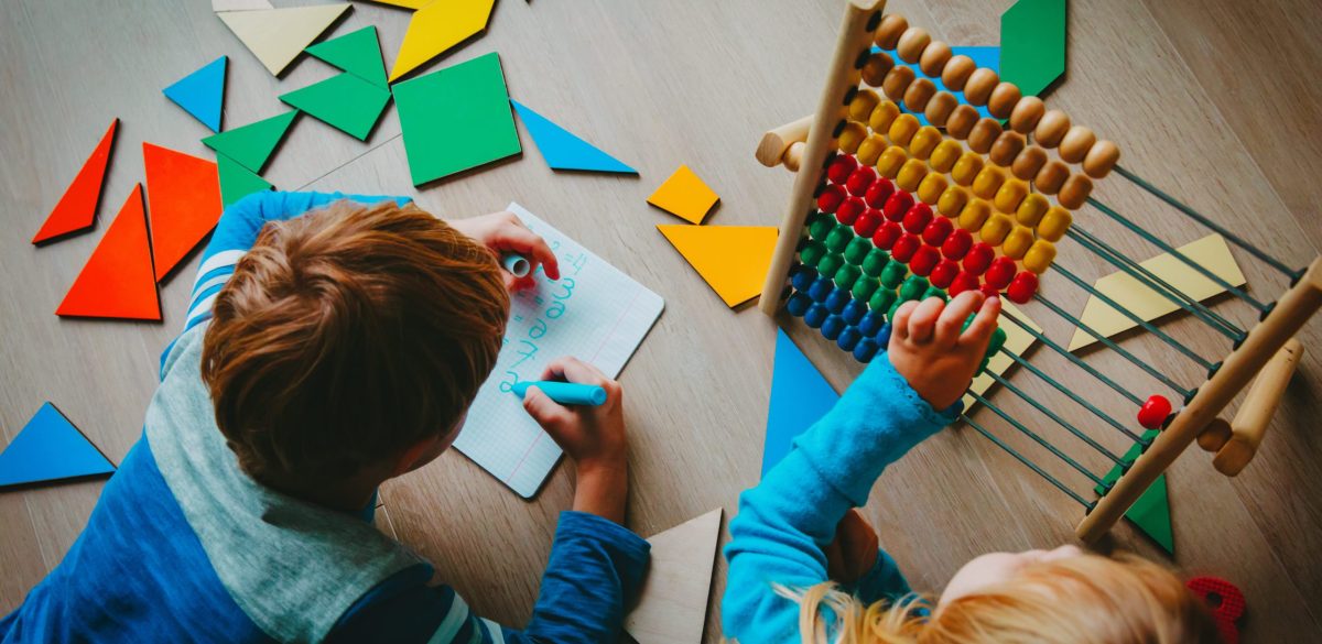 little boy and girl learn to write and calculate numbers, education